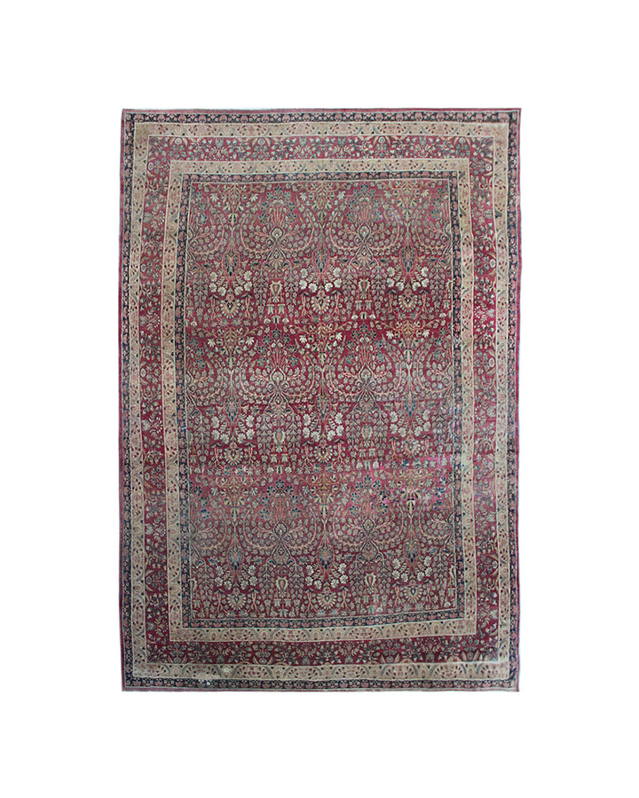 Antique Persian Kermanshah wool area rug featuring intricate floral designs in burgundy, deep navy blue, and white with a low pile