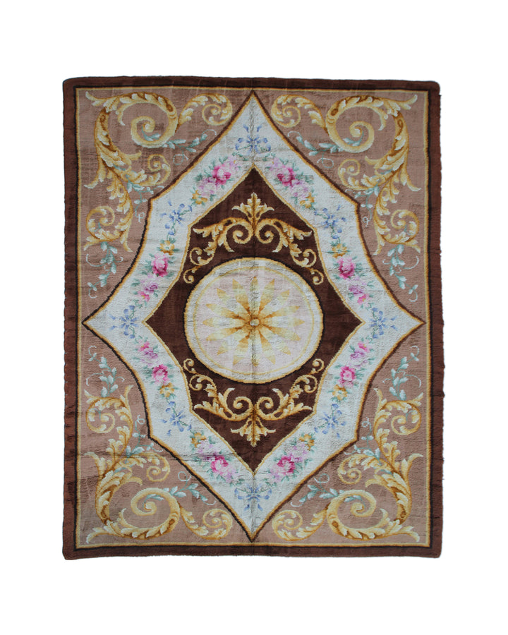 10'x13' antique Spanish Savonnerie area rug with intricate floral motifs in brown, gold, ivory, and pink