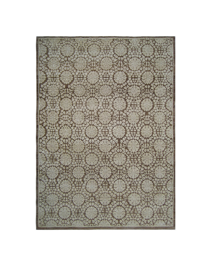 A rectangular area rug with an intricate repeating geometric and floral pattern in brown and beige, shown flat against a solid white background.