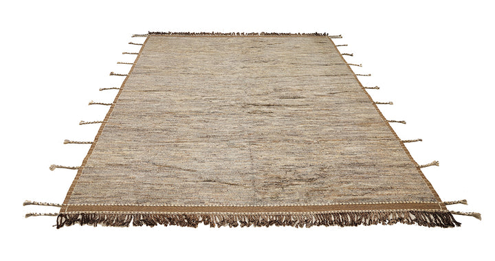 Beige rug with tassels on a white background
