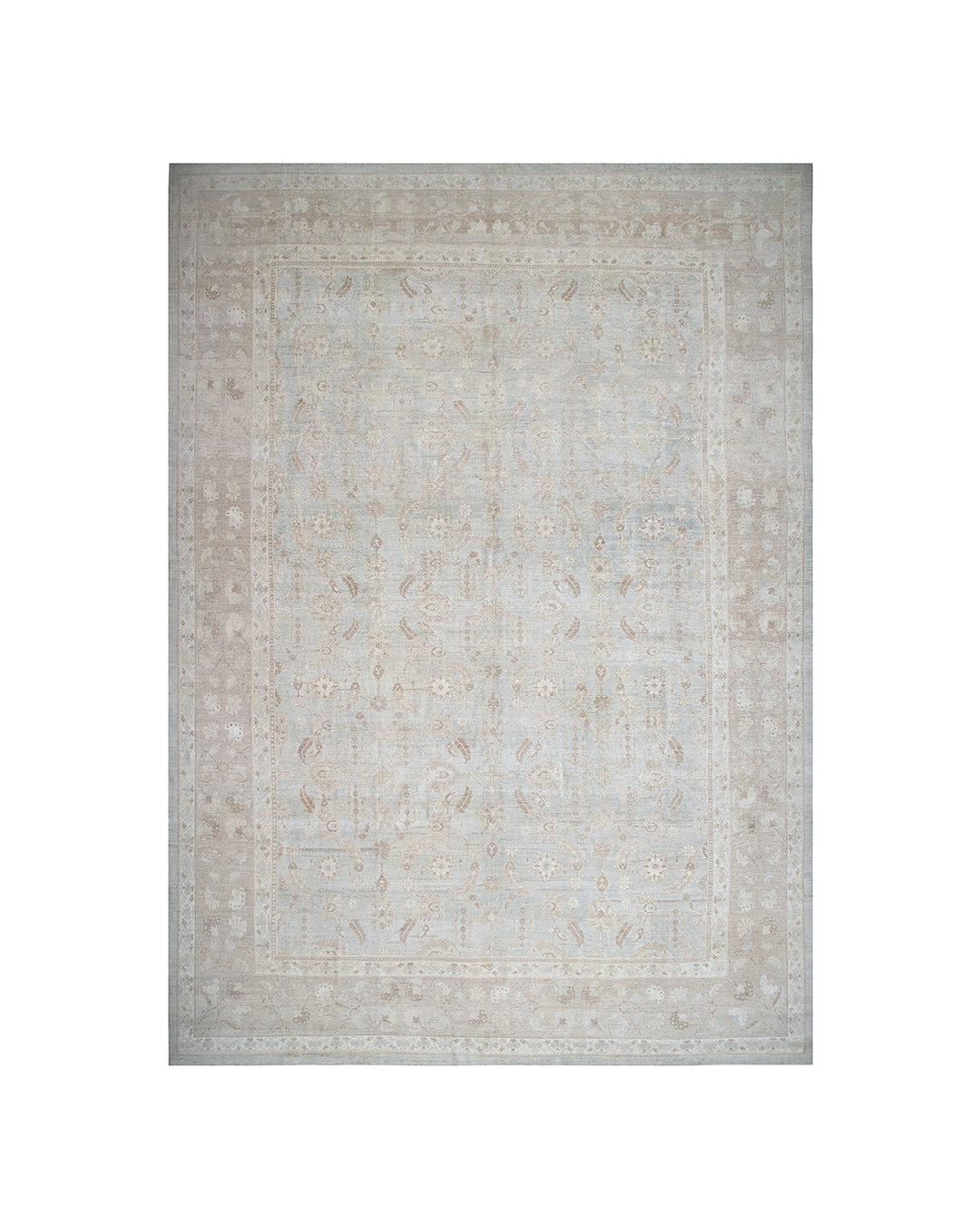 Beige area rug with a subtle pattern on a white background