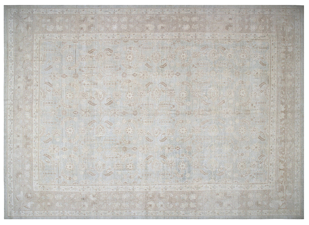A square area rug with a distressed traditional pattern in soft beige, cream, and light gray tones.