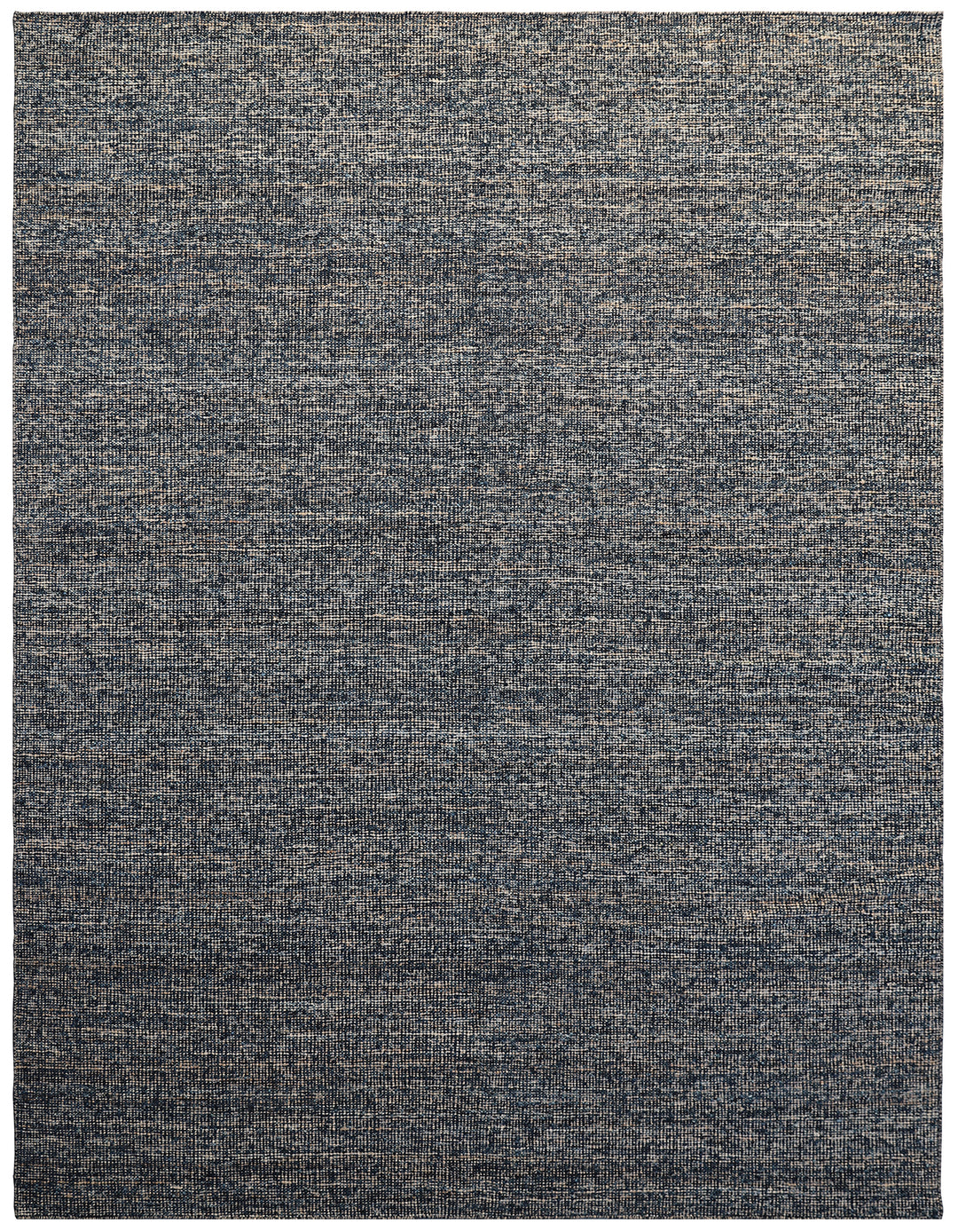 A modern flatweave rug with a gray color palette.