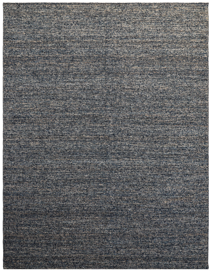 A modern flatweave rug with a gray color palette.