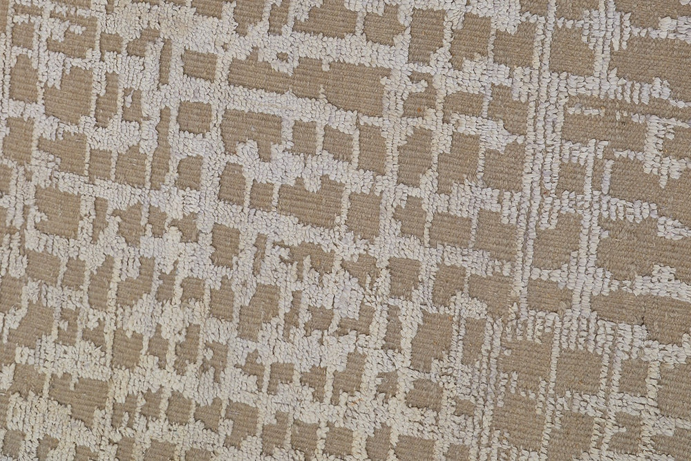 Textured fabric with a geometric pattern in beige and brown tones.