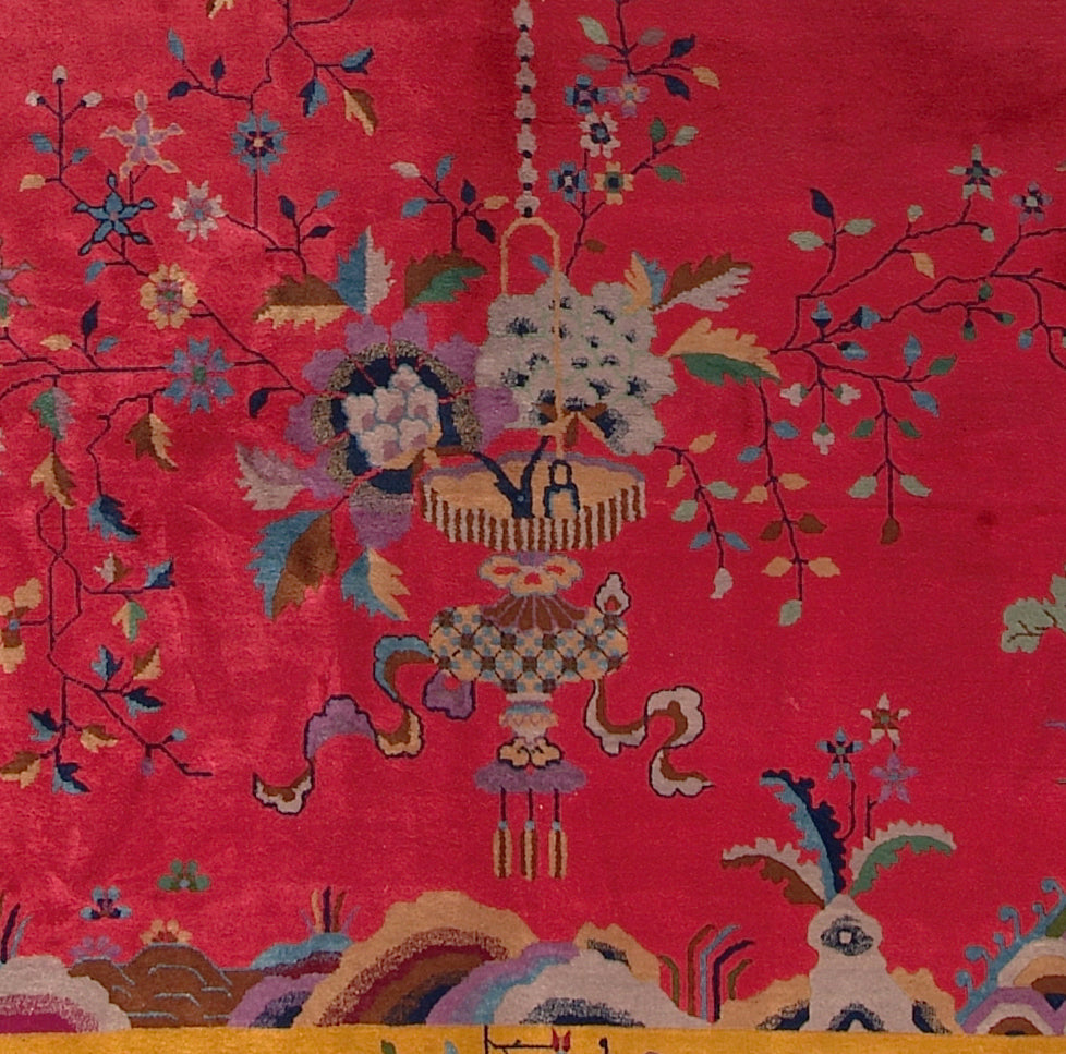Decorative fabric with intricate floral and chandelier design on a red background
