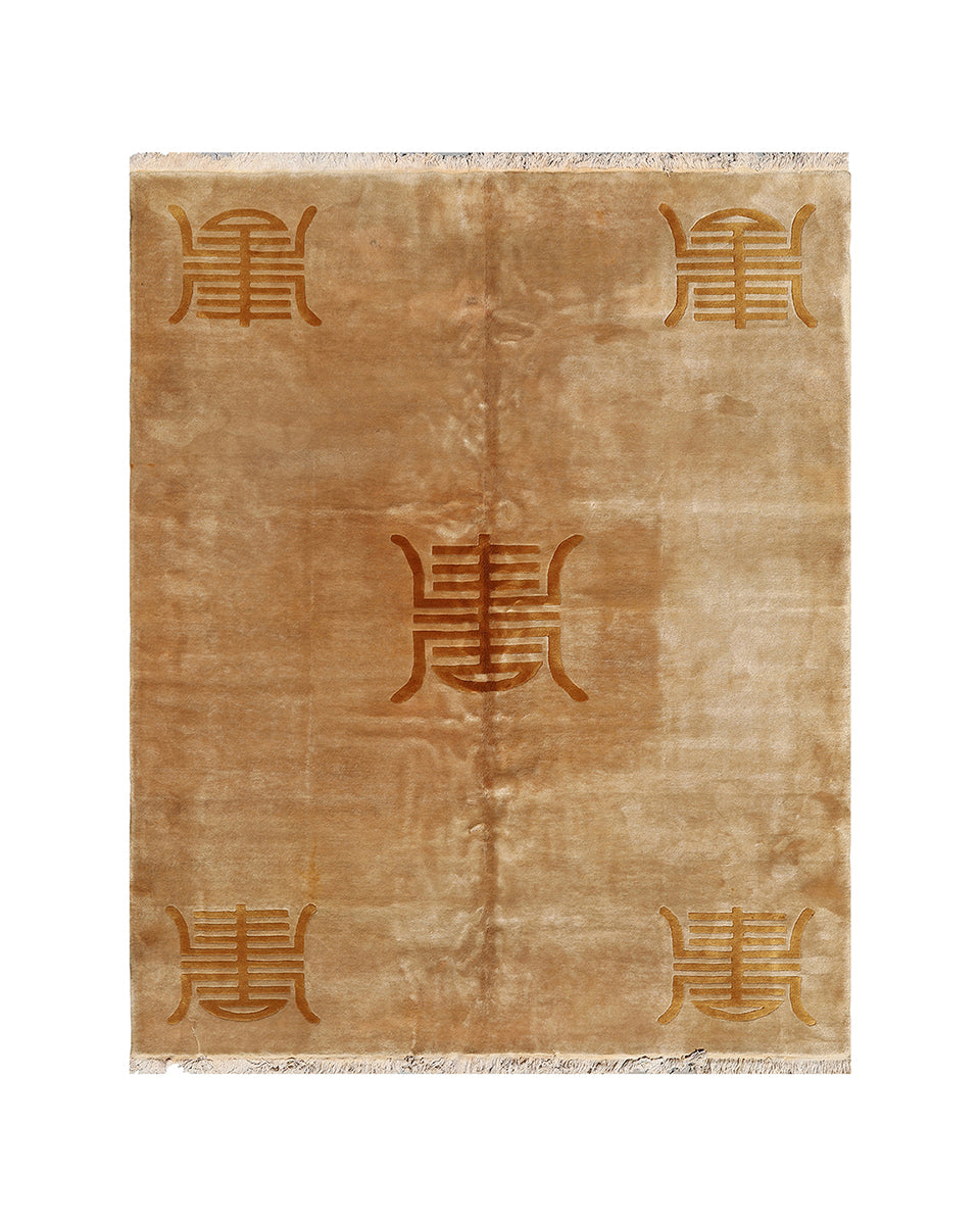 Beige rug with repeated brown design on a white background