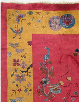A 10x14 vintage Chinese Art Deco rug in perfect condition with a vibrant red field, gold borders, and hand-knotted dragon, butterfly, and lantern motifs.