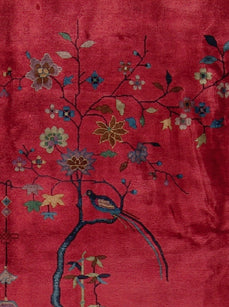 A 10x14 vintage Chinese Art Deco rug in perfect condition with a vibrant red field, gold borders, and hand-knotted dragon, butterfly, and lantern motifs.