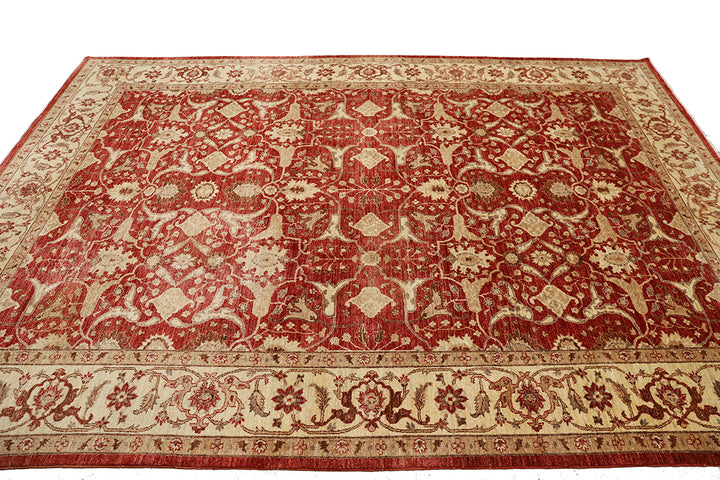 Red and beige patterned rug on a white background