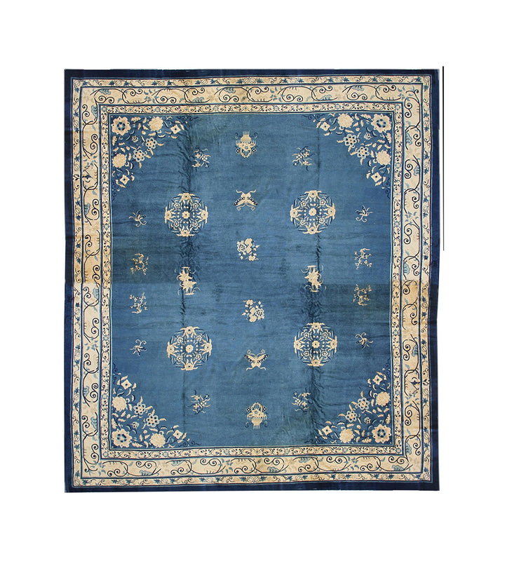 Blue patterned rug with decorative border on a white background