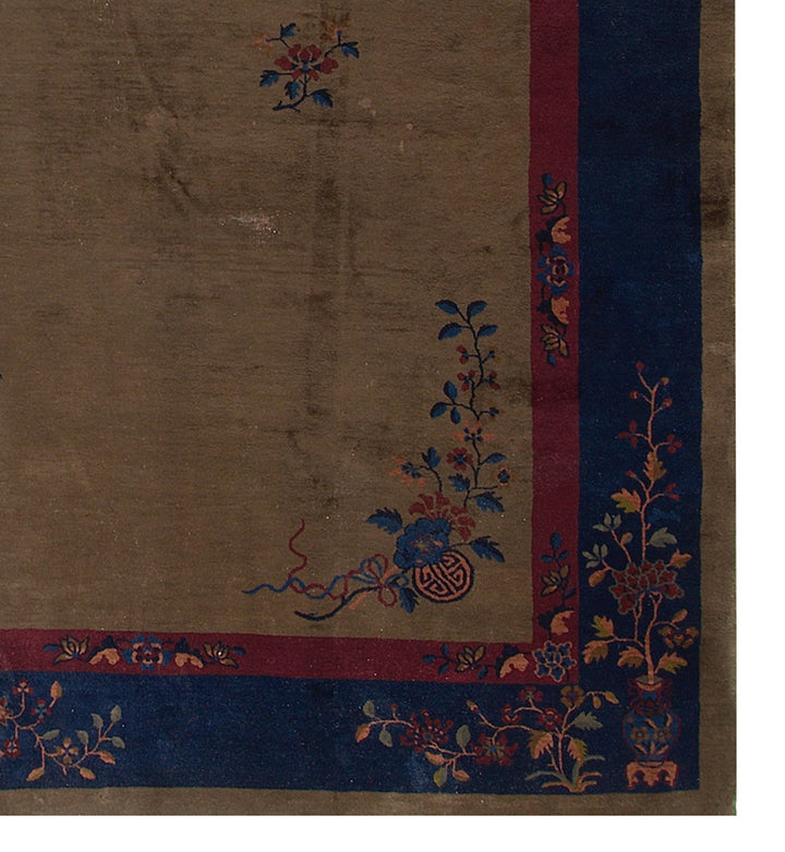 Decorative fabric with floral patterns and a border on a brown background