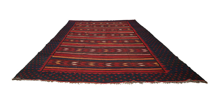 Woven rug with red and black pattern