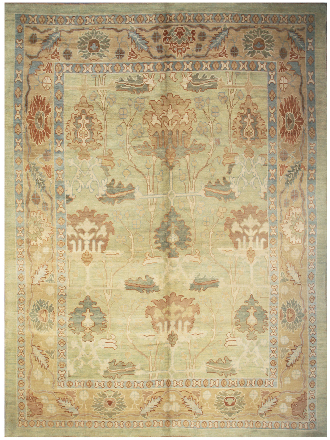 A hand-knotted Turkish rug with a floral Arts and Crafts design in shades of green, gold, terracotta, and yellow.