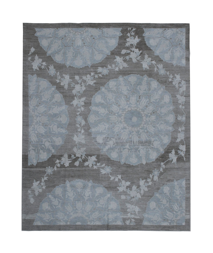 Gray and blue floral patterned rug on a plain background