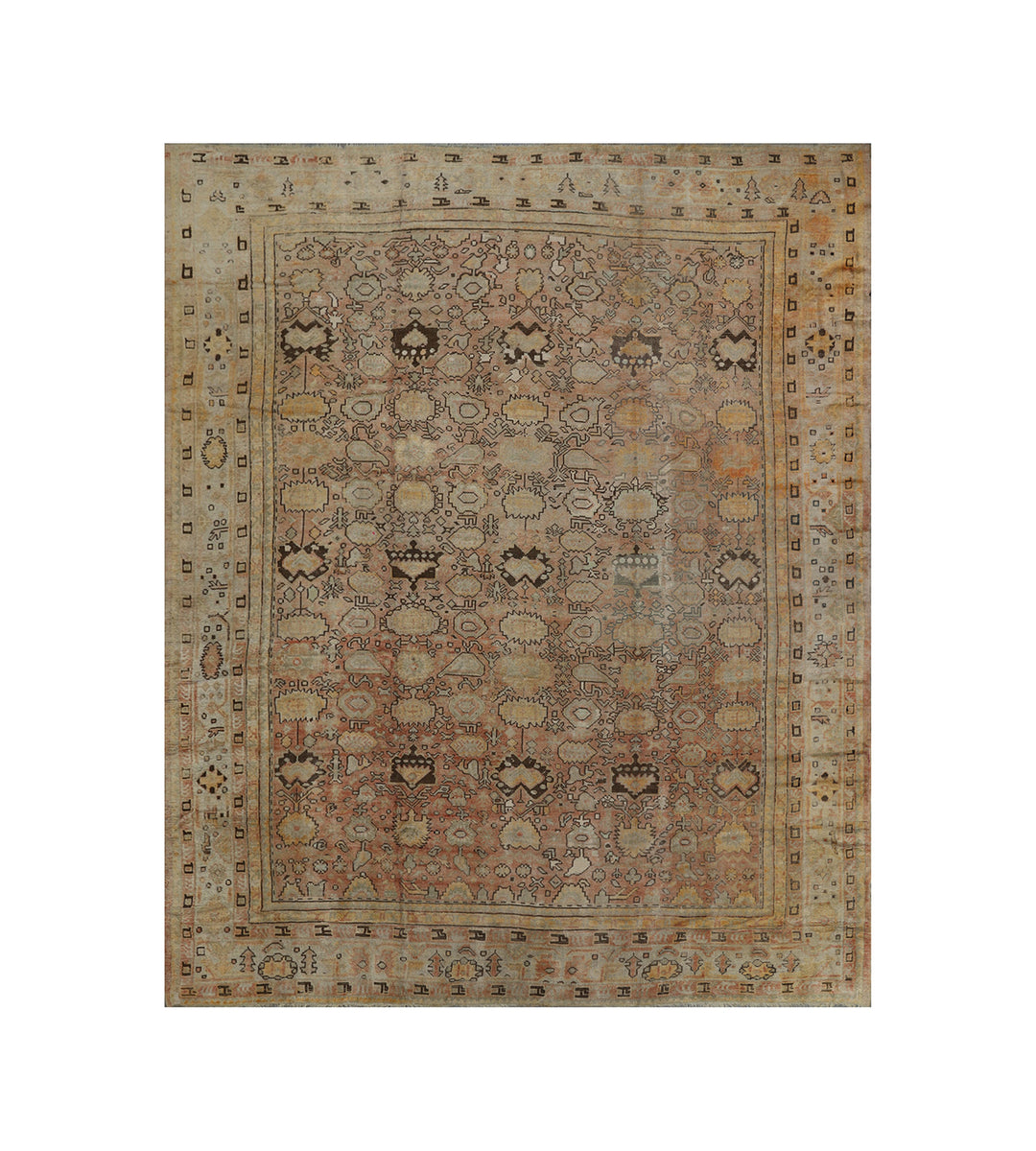 Oversized 12'x15' antique Turkish Oushak rug featuring a large-scale geometric design in faded pink, gold, and warm brown from Ariana Rugs.