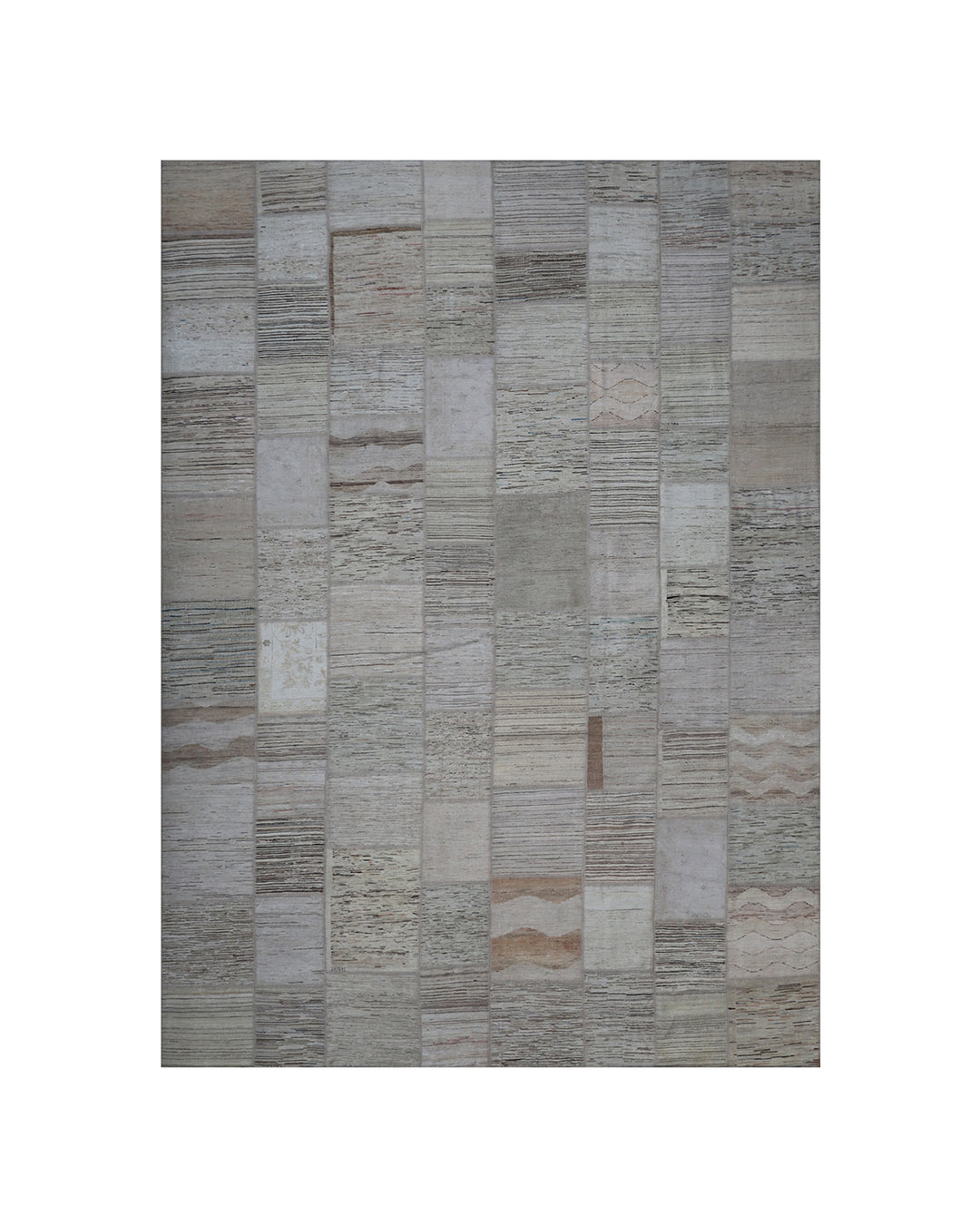 Patchwork rug with brown and beige pattern on a white background