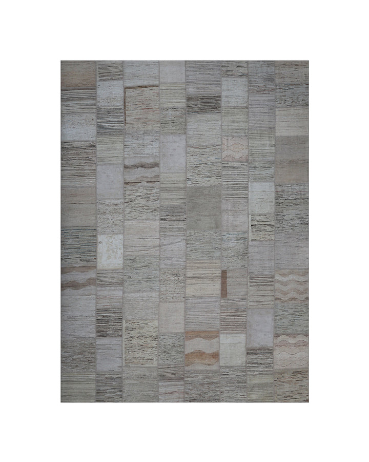 Patchwork rug with brown and beige pattern on a white background