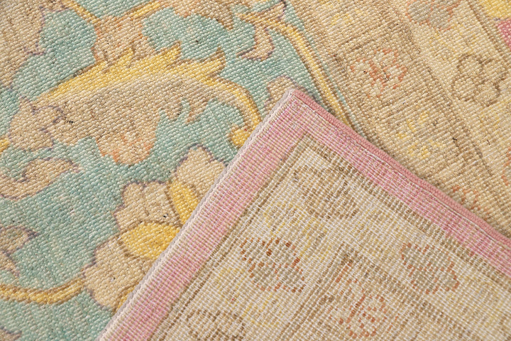 12x18 luxury hand-knotted Afghan Sultanabad rug with hot pink field and blue floral border by Ariana Rugs West Hollywood