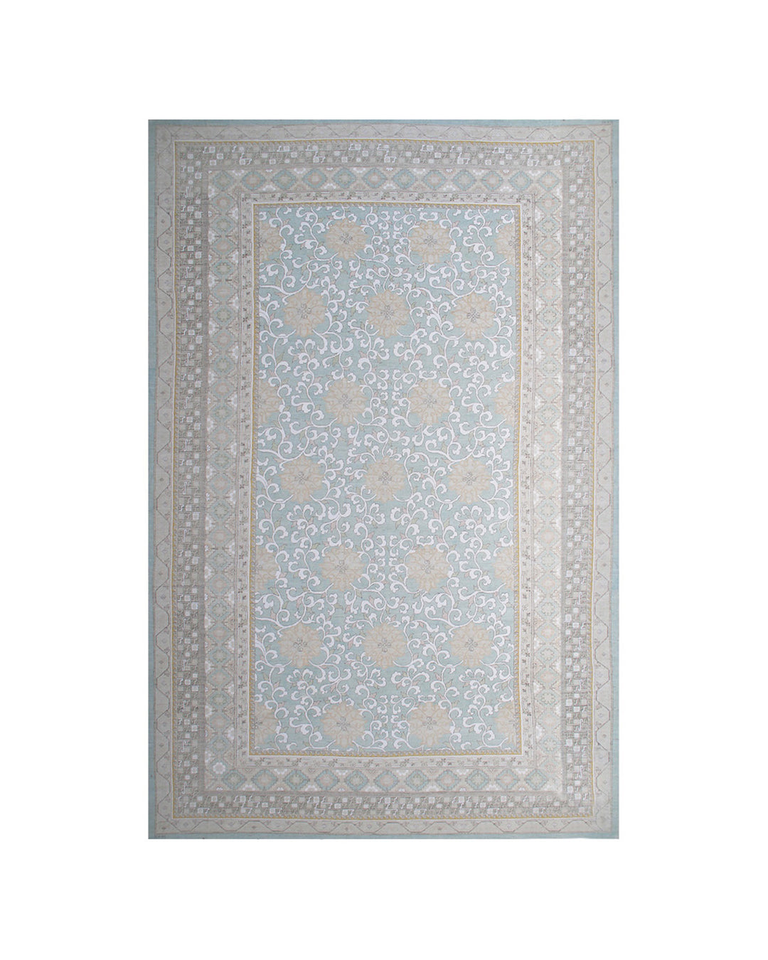 A rectangular area rug with a traditional floral pattern in light blue, beige, and gray tones, shown flat against a white background.