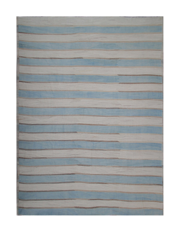 Striped rug with blue and beige pattern