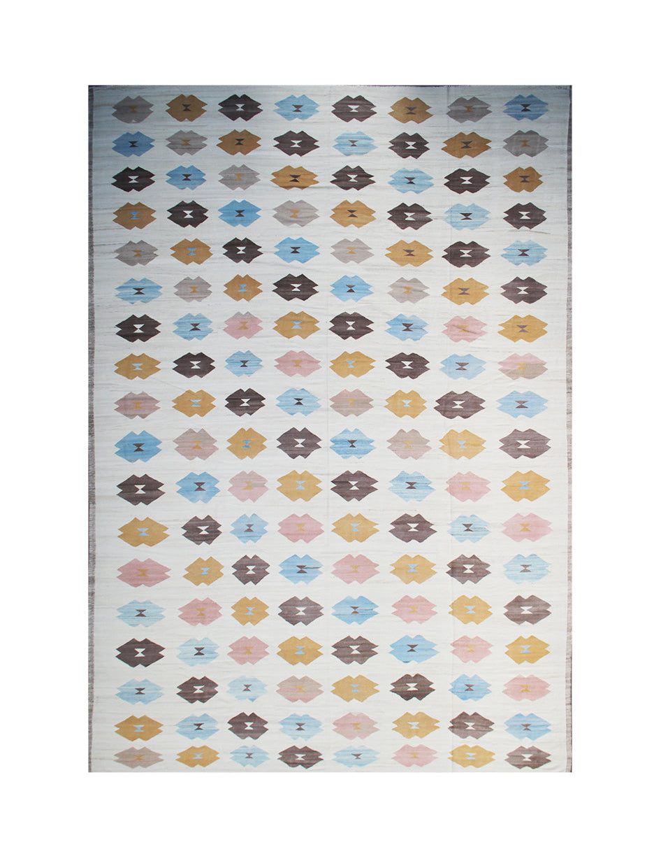 Patterned rug with colorful geometric design on a white background