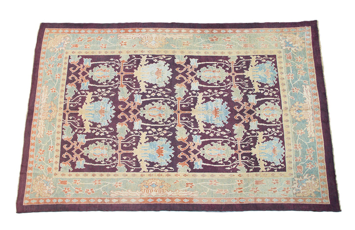 15x10 Dark Brown Burgundy Turkish Ushak rug with ivory and pastel orange Arts and Crafts floral pattern.