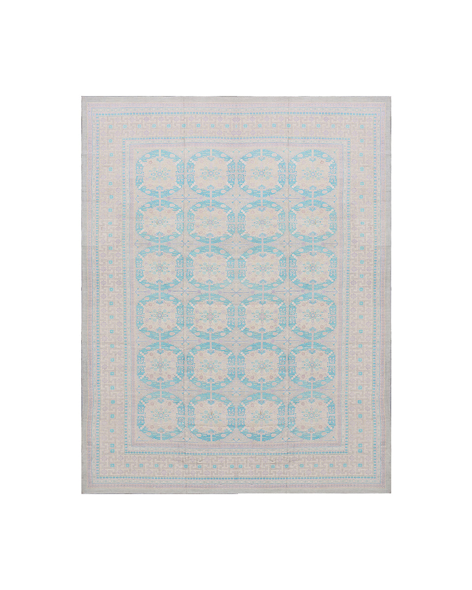 Patterned rug with blue and beige design on a white background