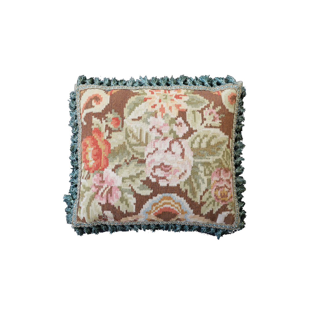 Handcrafted 18x21 brown floral wool accent cushion with white decorative tassels by Ariana Rugs.