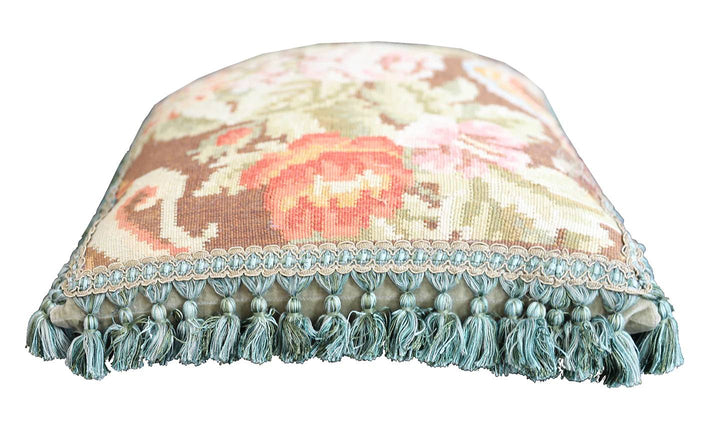 Handcrafted 18x21 brown floral wool accent cushion with white decorative tassels by Ariana Rugs.