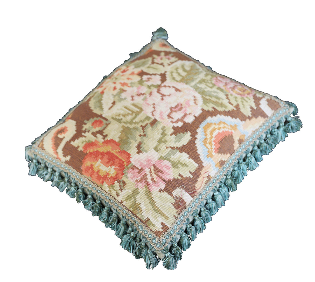 Handcrafted 18x21 brown floral wool accent cushion with white decorative tassels by Ariana Rugs.