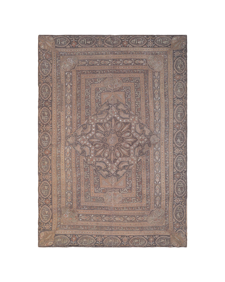 Decorative rug with intricate patterns on a white background