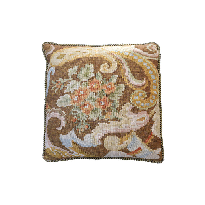 Handwoven brown floral wool cushion cover in warm earth tones by Ariana Rugs.