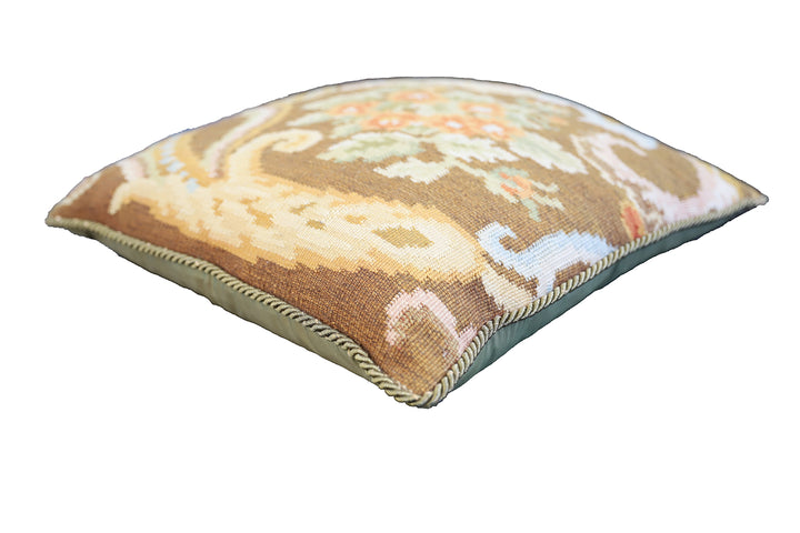 Handwoven brown floral wool cushion cover in warm earth tones by Ariana Rugs.