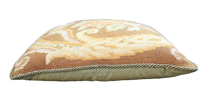 Handwoven brown floral wool cushion cover in warm earth tones by Ariana Rugs.