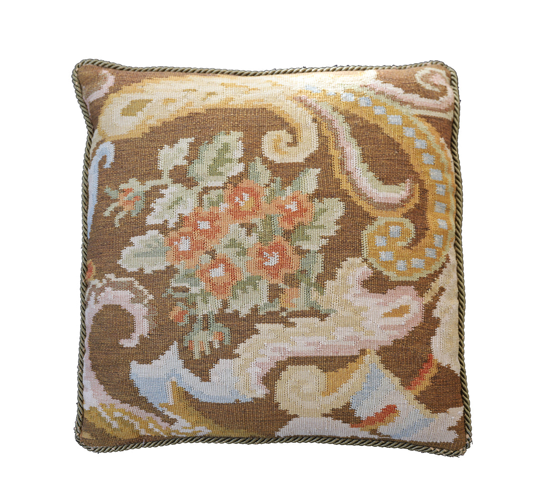 Handwoven brown floral wool cushion cover in warm earth tones by Ariana Rugs.
