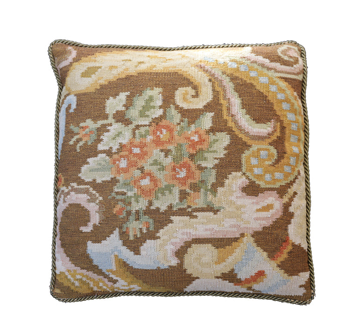 Handwoven brown floral wool cushion cover in warm earth tones by Ariana Rugs.