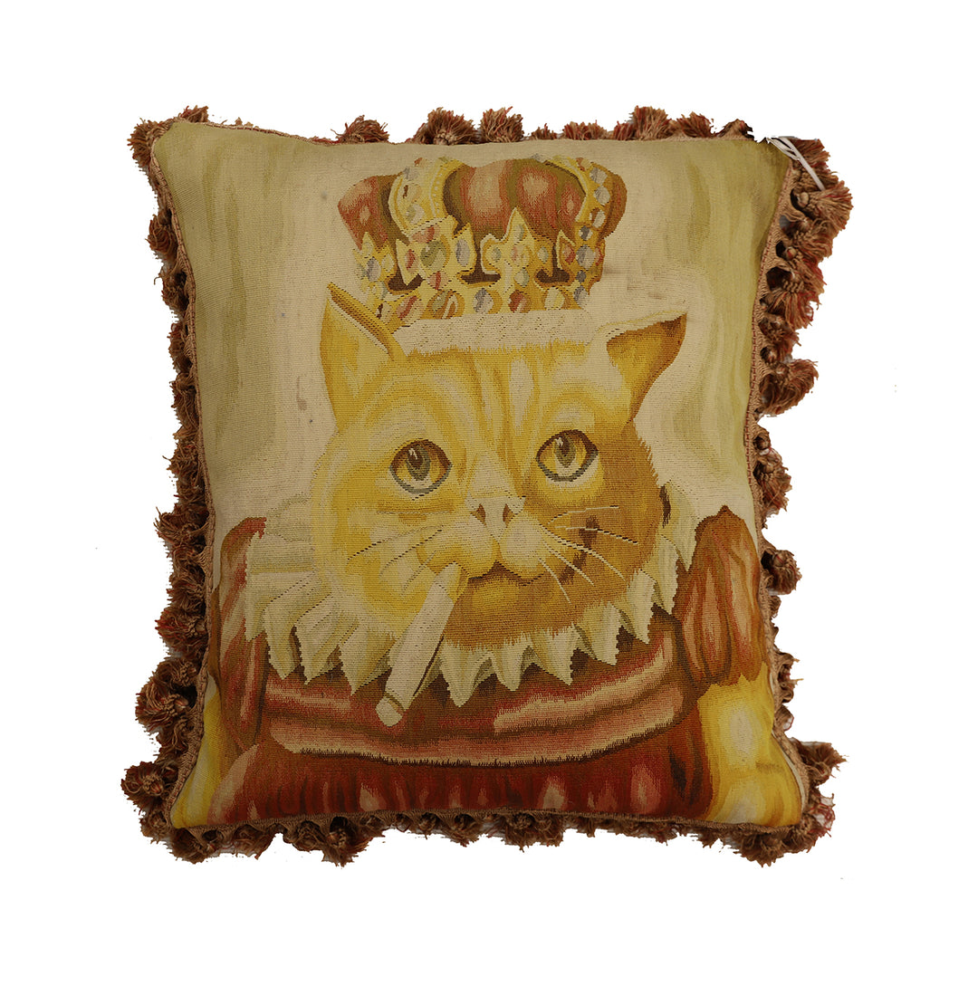 Decorative pillow with a cat wearing a crown on a beige background