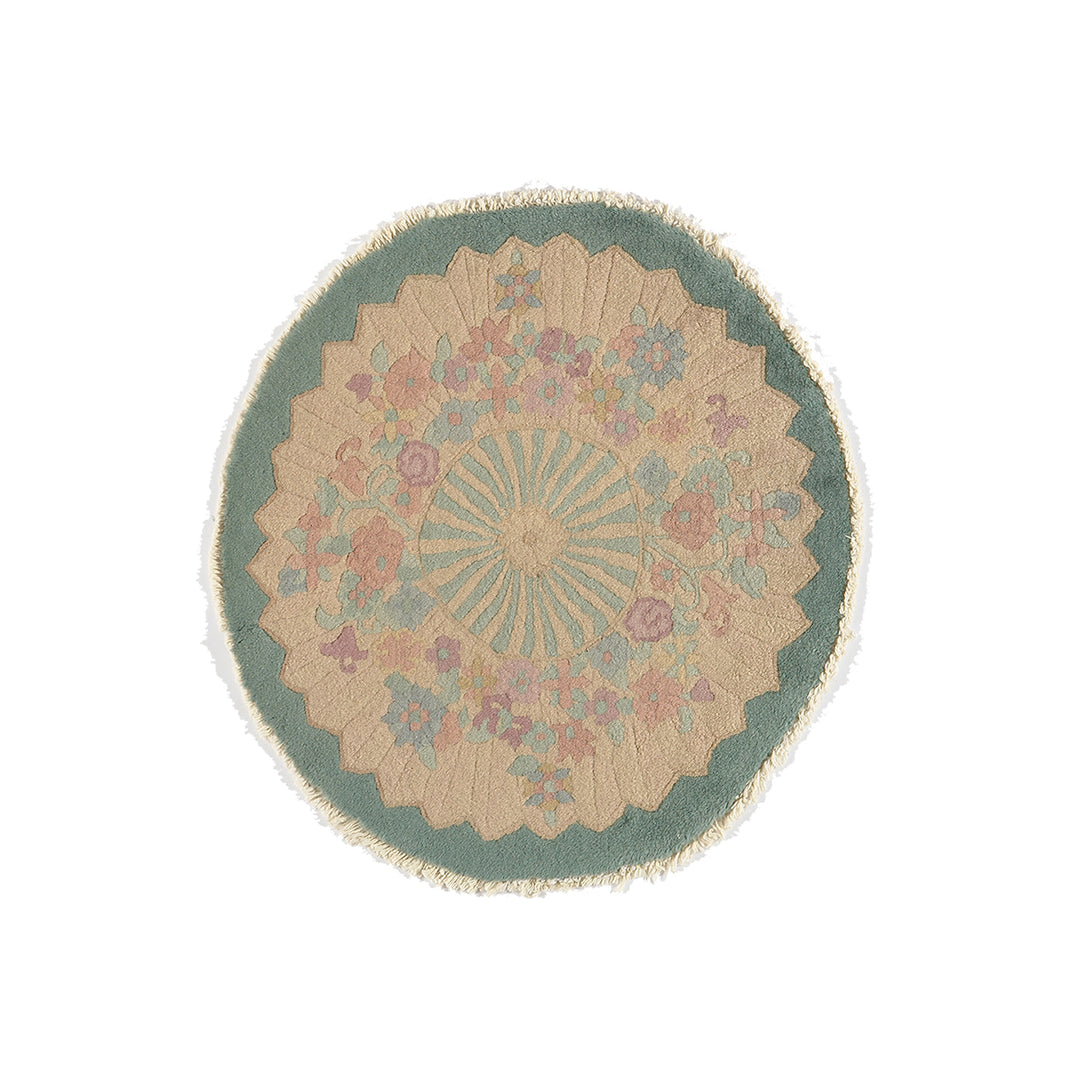 Round rug with floral pattern on a white background