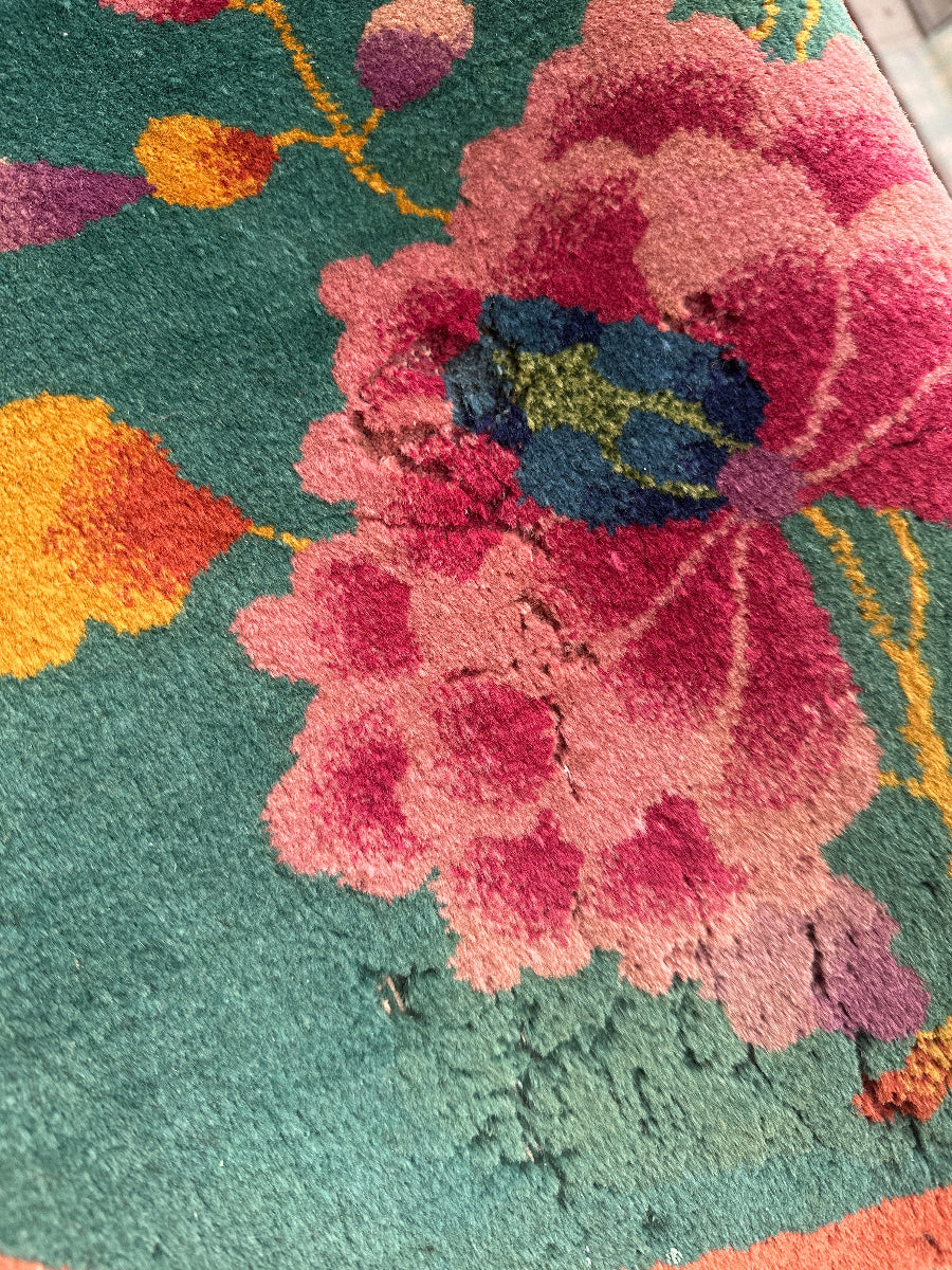 Close-up of a colorful floral pattern on a textured surface