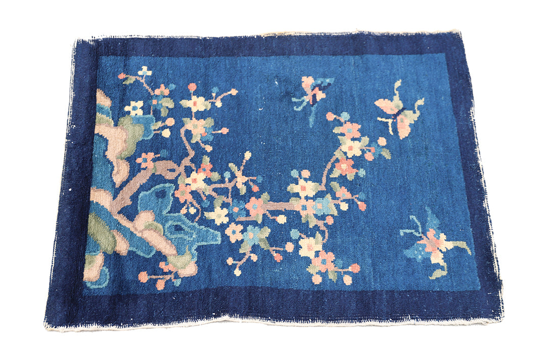 Blue rug with floral patterns