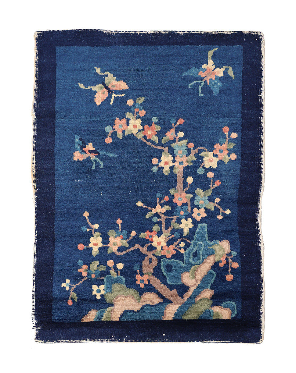 Decorative rug with floral pattern on a blue background