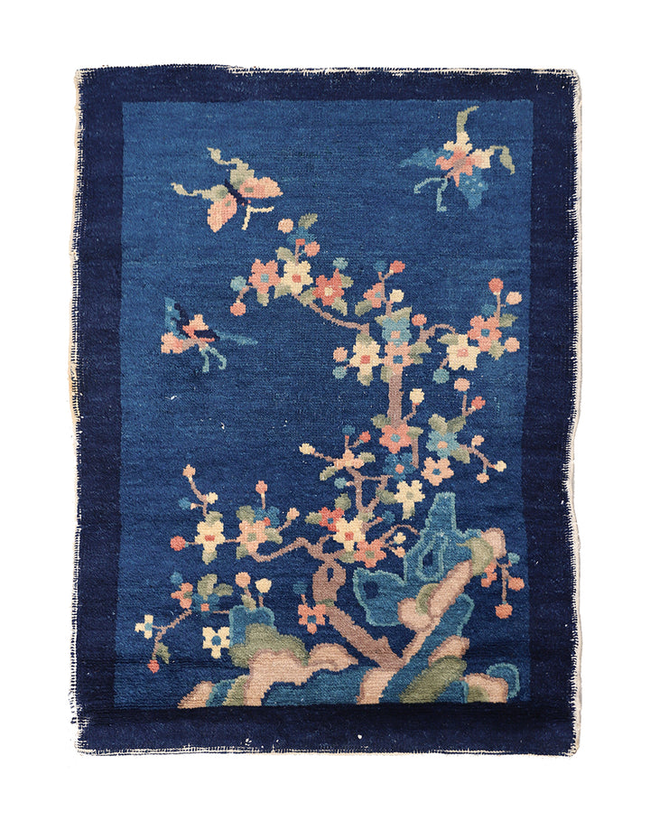 Decorative rug with floral pattern on a blue background