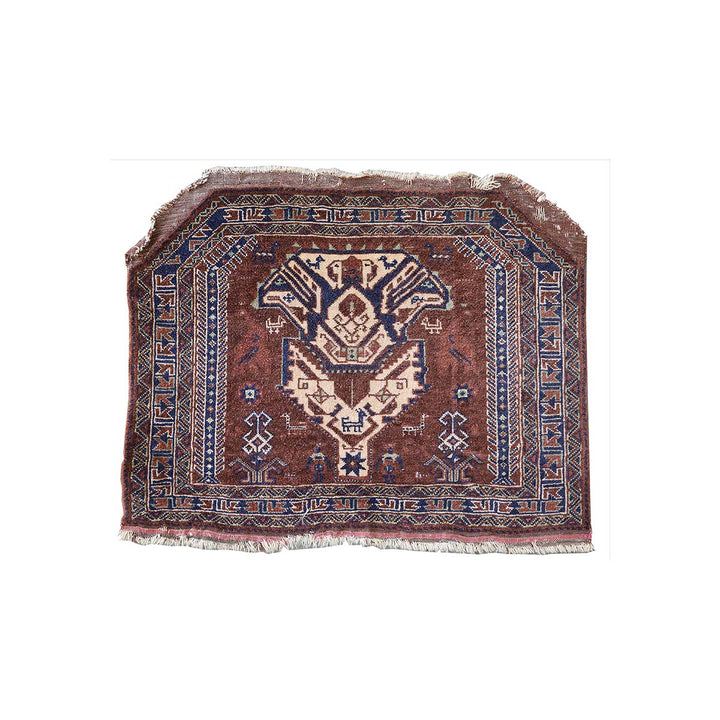 Small rug with intricate patterns on a white background