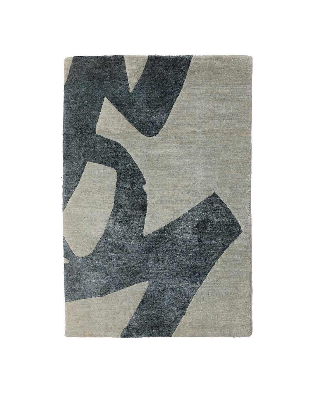 Gray and beige abstract patterned rug on a white background