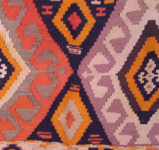 Close-up of a colorful patterned fabric with geometric designs.