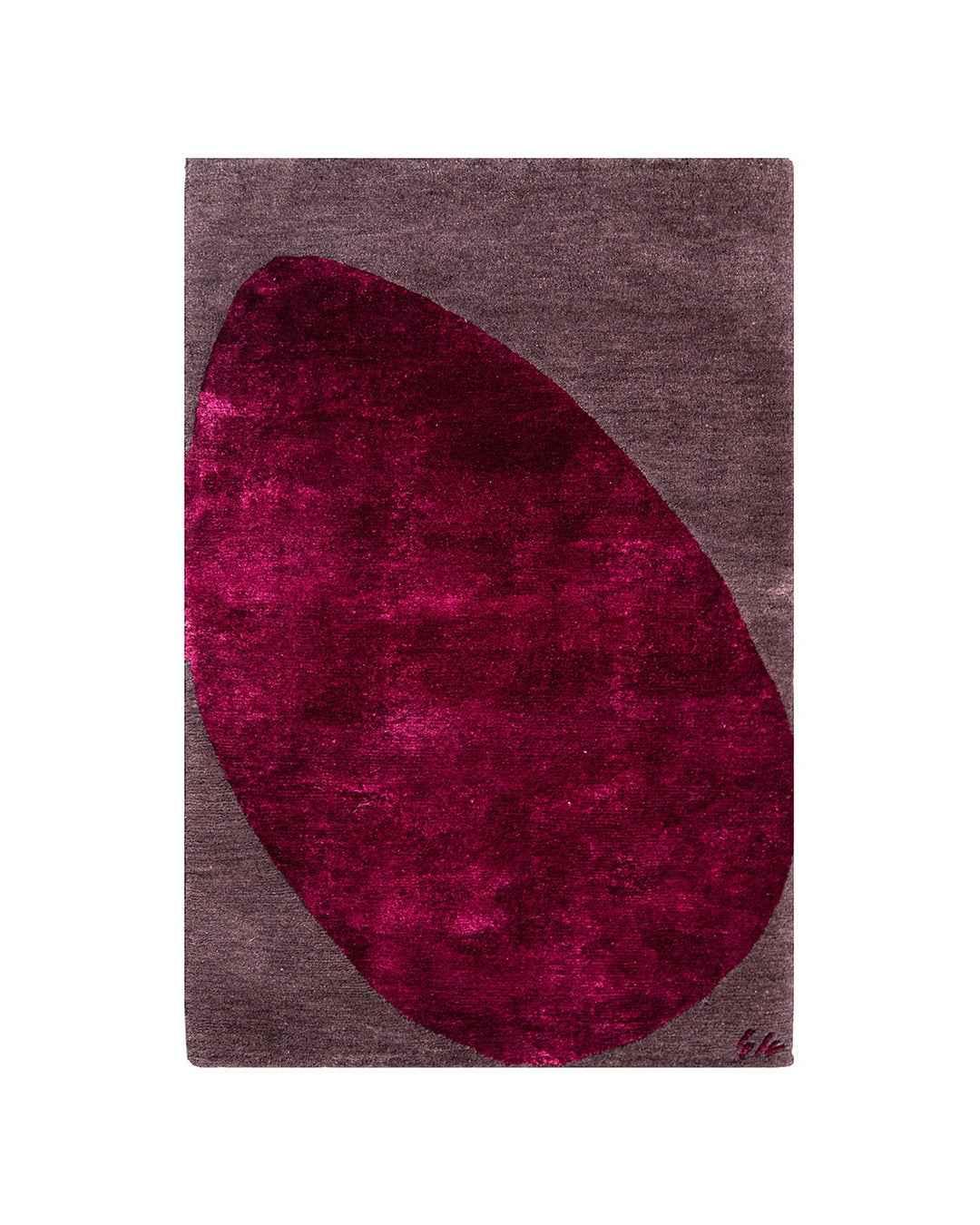 Rug with a large pinkish-red oval on a gray background