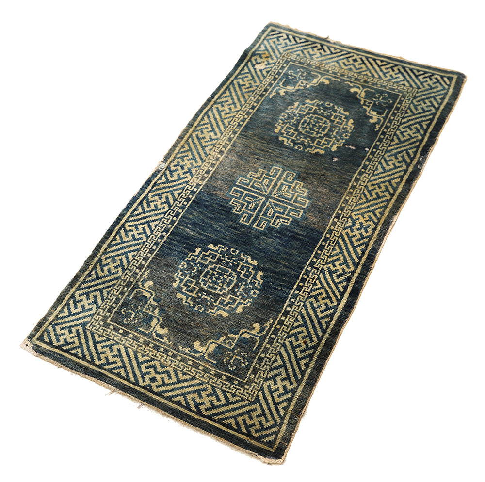 Decorative rug with geometric patterns on a white background