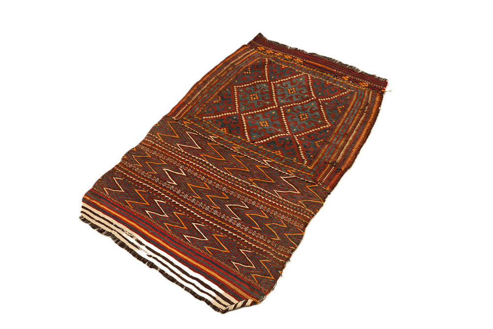 Folded fabric with intricate patterns on a white background