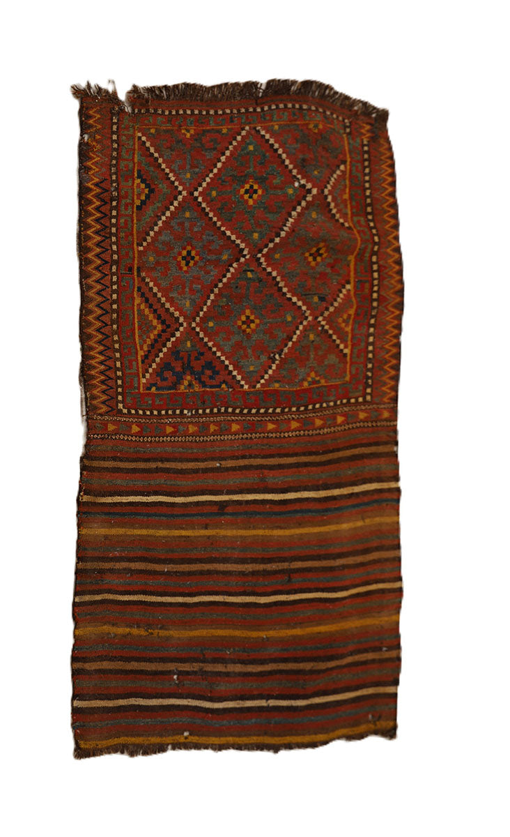 Traditional patterned rug with a geometric design on a white background